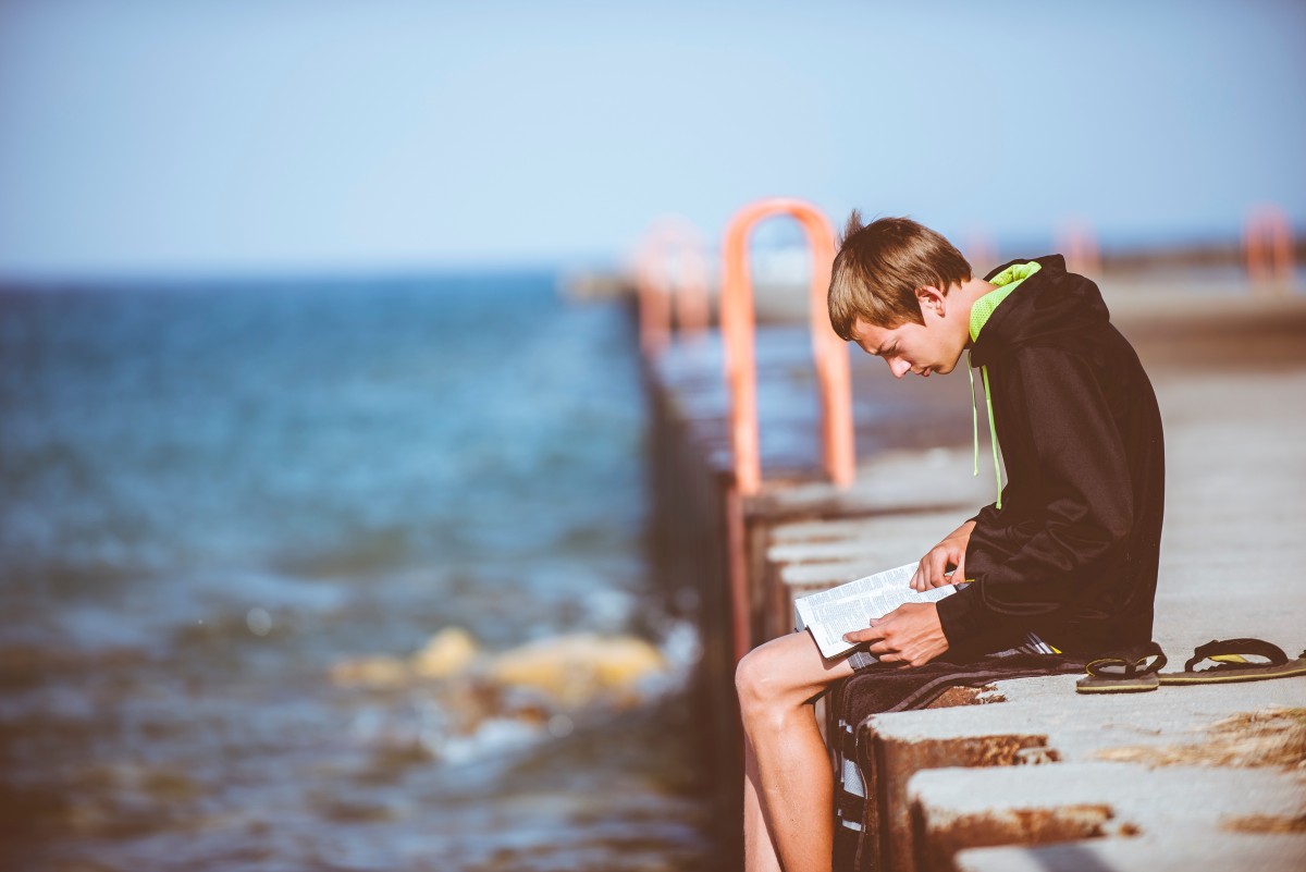 teen boy reading